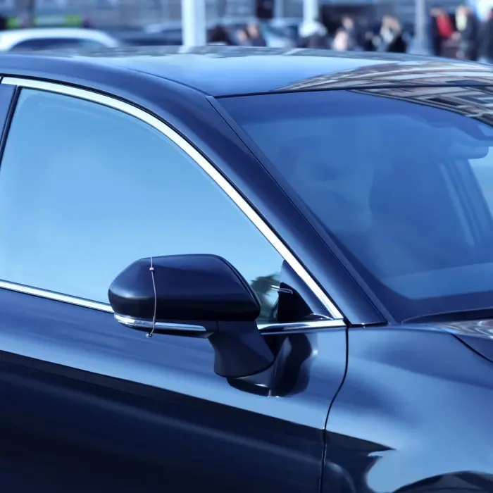 Blue car side mirror closeup