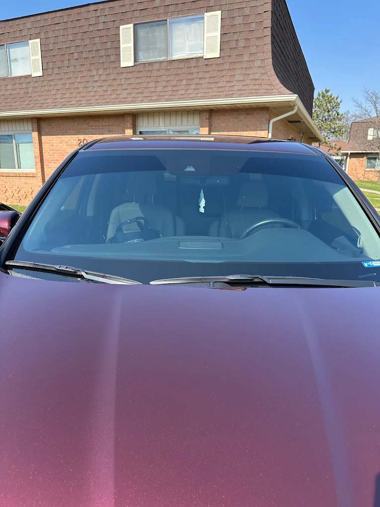 Maroon SUV parked house exterior