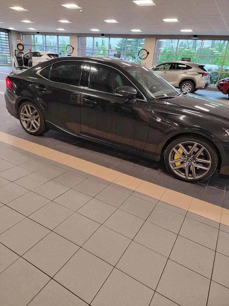 Black sedan in showroom