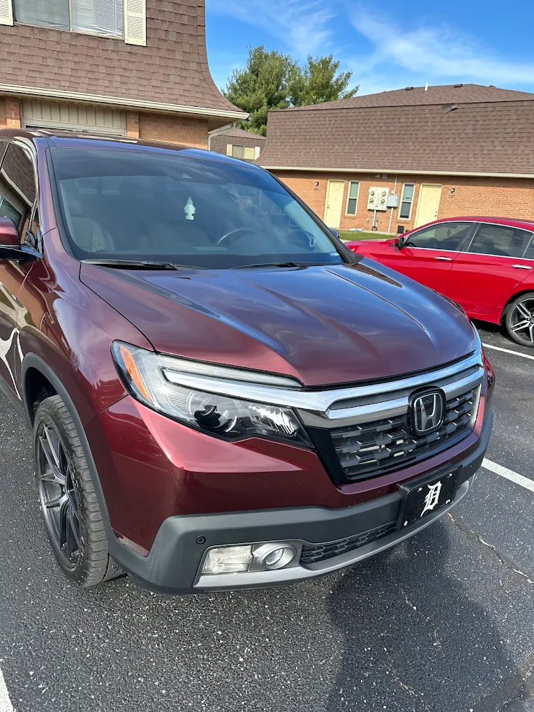 Maroon Honda SUV parked outdoors