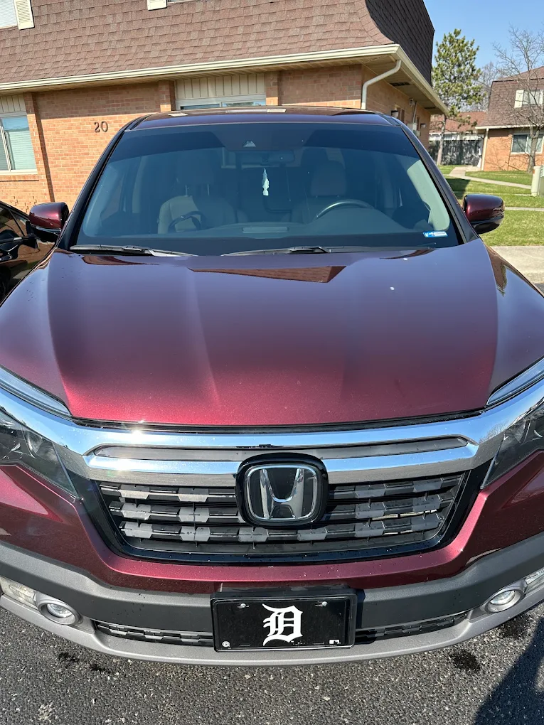 Maroon Honda SUV front view