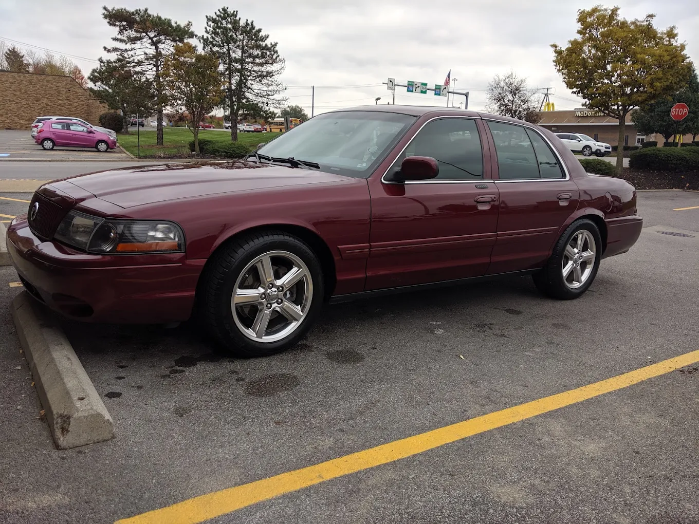 Maroon sedan parked outside