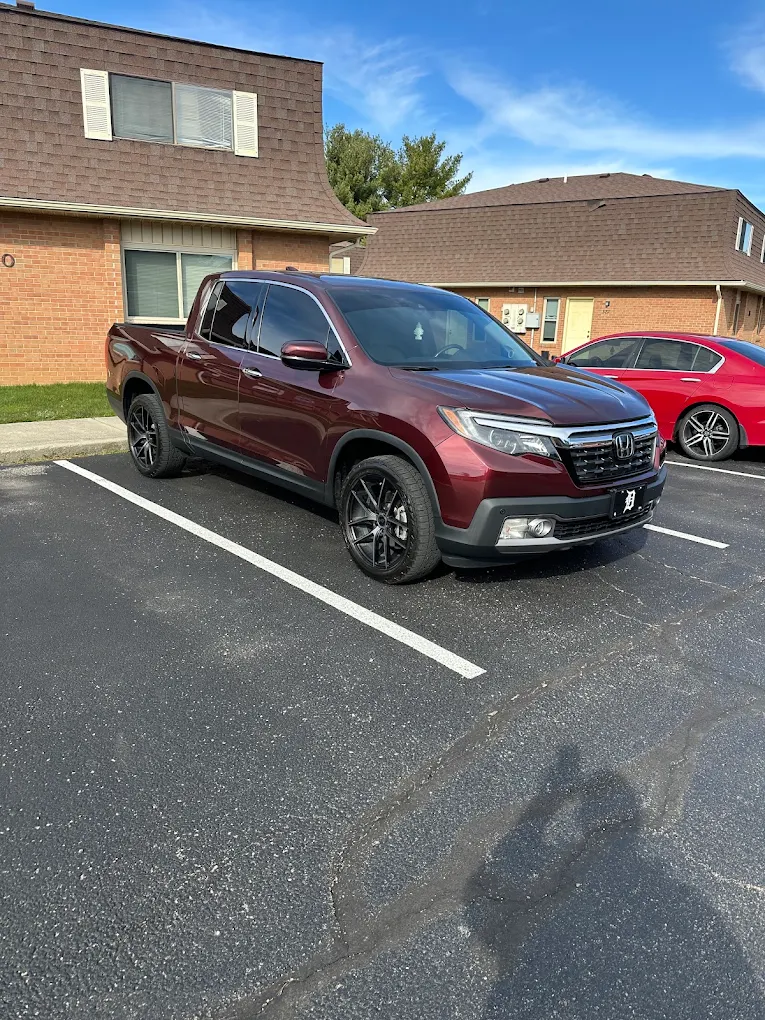 Maroon pickup truck parked outdoors